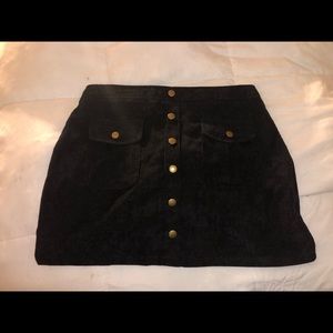 Black corduroy skirt with button detail